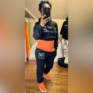 drawstring hoodie, long sleeves halter top. Long pants with side pockets.